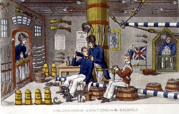 The Gun Room ، Newcome in the Bilboes ، لوحة من "مغامرات جوني نيوكوم في البحرية" لجون ميتفورد (1782-1831) 1818 (ليثو) بواسطة تشارلز (1797-1850) (بعد) ويليامز