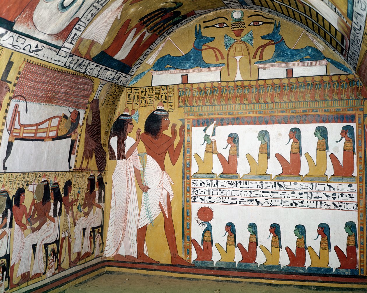 سننجم وزوجته يواجهان ناووس يحتوي على اثني عشر إلهًا ، من الجدار الغربي لمقبرة سننجم ، قرية العمال ، المملكة الحديثة (رسم جداري) بواسطة الأسرة المصرية التاسعة عشرة