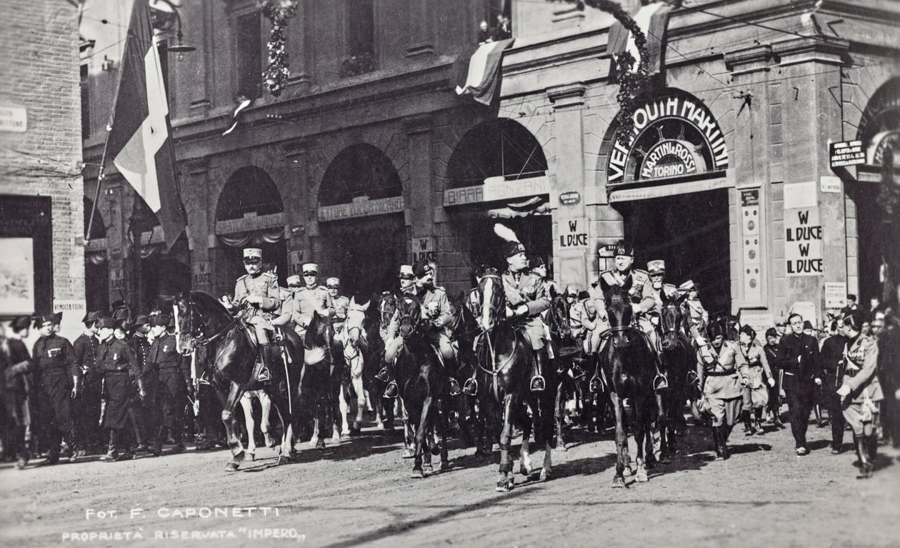 Album "Duce": Benito Mussolini on horseback parading through the streets of Ferrara (b/w photo) بواسطة F. Caponetti