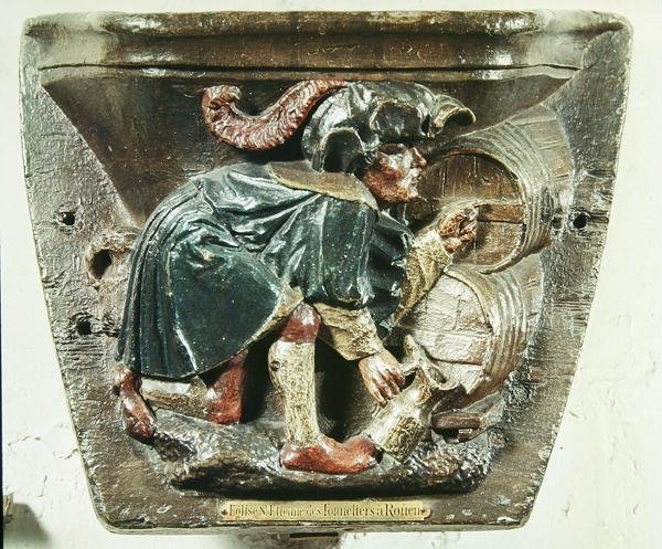 Misericord من كشك جوقة يصور رجلًا يختبر النبيذ ، من كنيسة Saint-Etienne des Tonneliers ، Rouen (خشب متعدد الألوان) بواسطة المدرسة الفرنسية