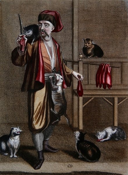 يقوم الألباني Dgi-Guerdgi بإطعام القطط في البازار في القسطنطينية بكبد الأغنام ، من Recueil d'estampes sur les Costumes du Levant '، نقشها جيرارد جان بابتيست سكوتان (1671-1716) 1707-08 (نقش ملون) بواسطة المدرسة الفرنسية