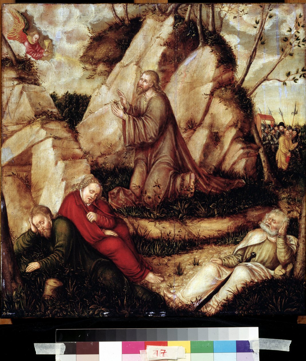 "صلاة في بستان الزيتون" (عذاب في البستان) بعد العشاء الأخير ، ذهب المسيح إلى تل الجثسيماني المطل على القدس مع الرسل. اقترب مساعدو يهوذا من الجنود الرومان للقبض عليه. الرسم على الخشب بواسطة L. بواسطة لوكاس الأكبر كراناش