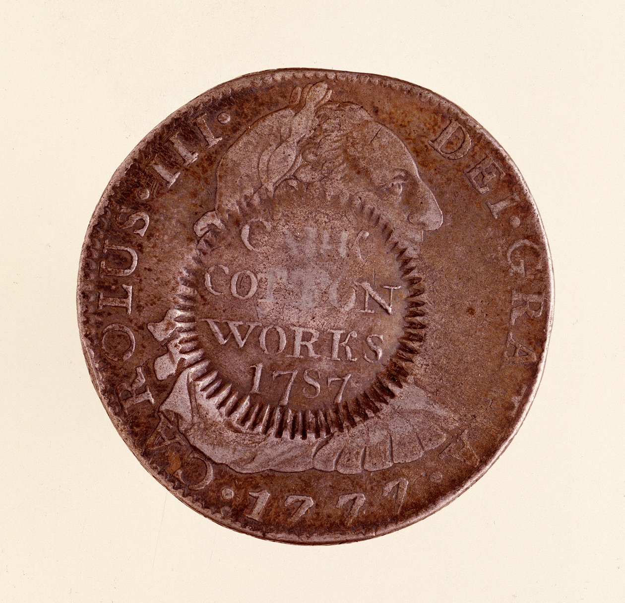 عملة فضية (8 ريالات) من إسبانيا: عهد تشارلز الثالث (1759-1788). 1777 مع عداد 1787. ديم. 3.9 سم نابولي ، المتحف الأثري بواسطة المدرسة الاسبانية