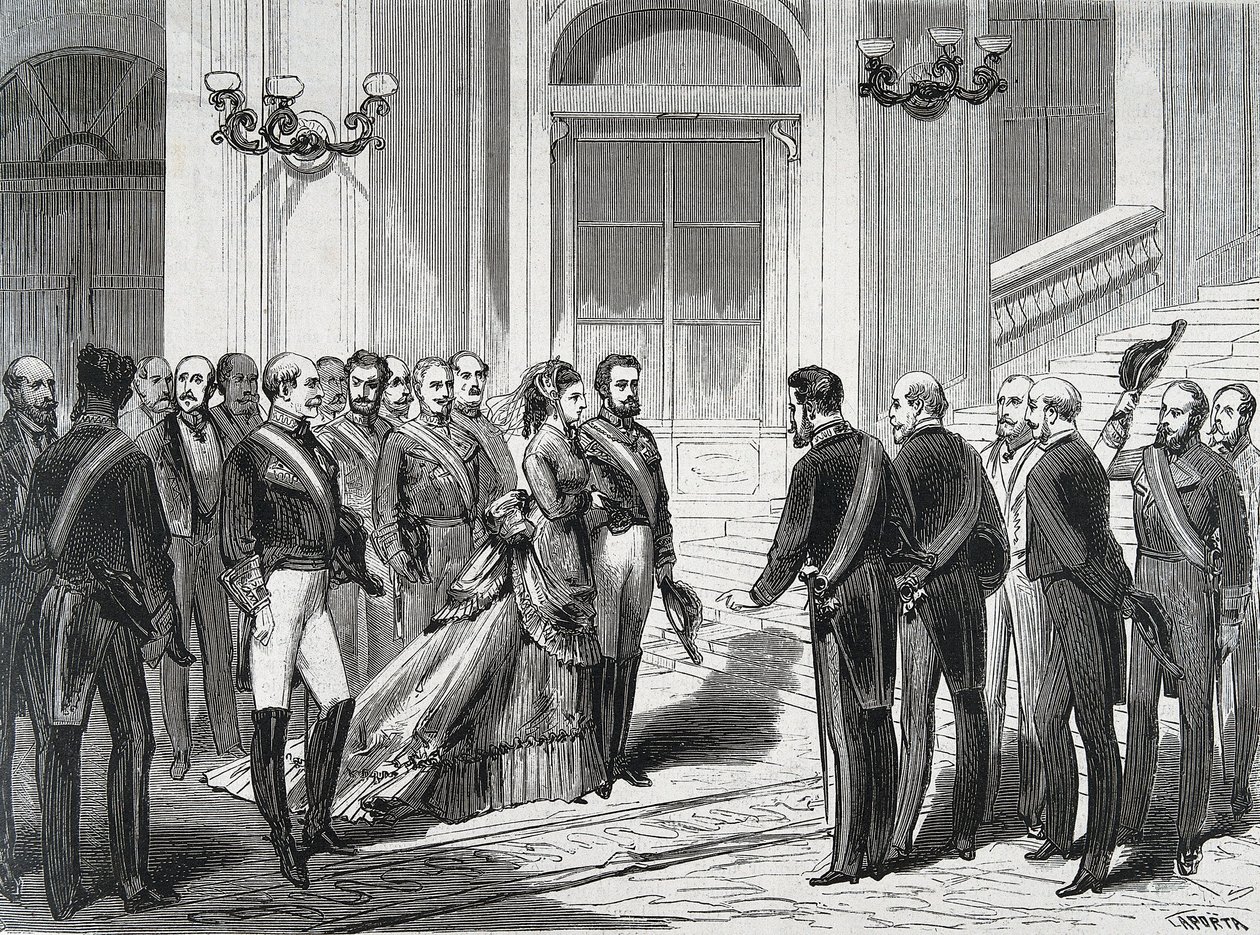 ملك إسبانيا أميدي الأول (أميديو فرديناندو ماريا دي سافويا) (1845-1890) وزوجته الملكة ماري فيكتوري دال بوزو ديلا سيستيرنا (1847-1876) عند وصولهما إلى القصر الملكي في مدريد في 19/03/1871. نقش من "" La Ilustracion Espanola y America بواسطة المدرسة الاسبانية