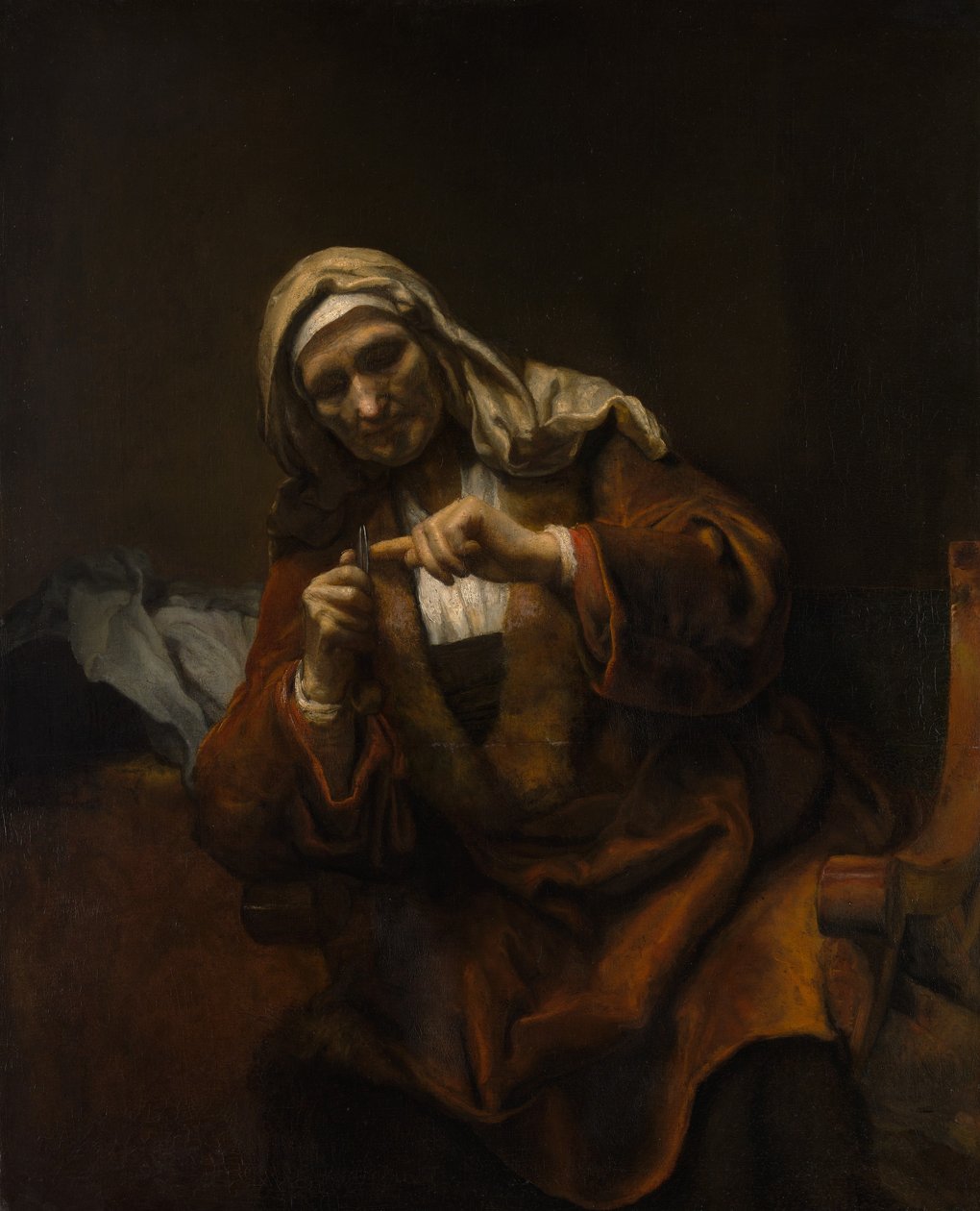 امرأة عجوز تقص أظافرها ، كاليفورنيا. 1655-60. بواسطة أسلوب رامبرانت