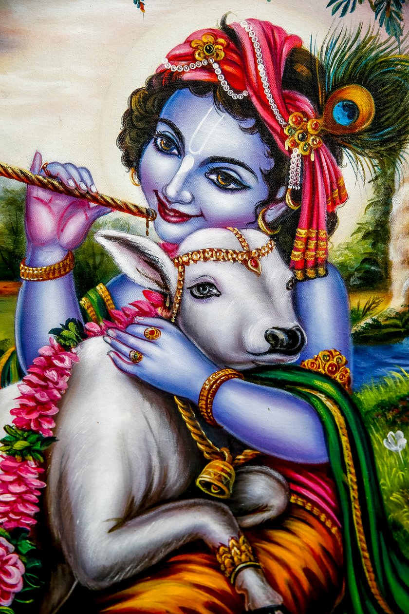 Hindu god Krishna with a calf. Watford, U.K. (photo) بواسطة غير معروف