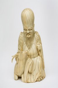 الرقم العاجي المنحوت لشو شينغ جالسًا مع الغزلان ، c.1580-1644 بواسطة المدرسة الصينية