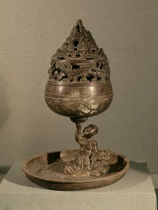 مبخرة على شكل جبل كوني "po-shan-lu" يحملها رجل جالس على وحش ، من مقبرة الأميرة Tou Wen ، Mancheng ، Hebei ، أسرة Han الغربية (برونزية)