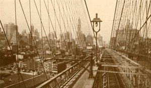 عرضت مانهاتن السفلى من خلال شبكة الكابلات على جسر بروكلين المعلق ، c1930. بواسطة ENA