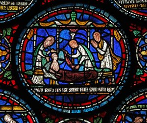 نافذة s6 التي تصور مشهدًا من نافذة St Thomas Becket Miracle: Cicely of Plumstead (؟) تجلس على رصيفها بواسطة مدرسة اللغة الإنجليزية