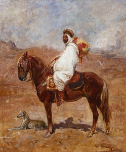 عربي على حصان في منظر صحراوي