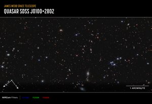 كوازار J0100+2802 (صورة بوصلة NIRcam) بواسطة تلسكوب جيمس ويب الفضائي (ناسا)