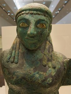Bronze female winged figure (590 BC - 580 BC), Olympia Museum, Olympia (???????), Peloponnese, Greece (photo) بواسطة غير معروف