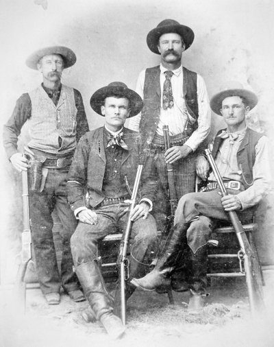 Texas Rangers armed with revolvers and Winchester rifles بواسطة مصور أمريكي