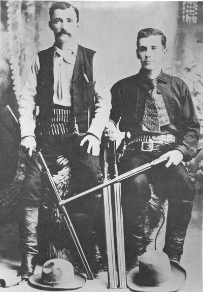 Wells Fargo stagecoach messengers armed with shotguns and Winchester repeating rifles (b/w photo) بواسطة مصور أمريكي