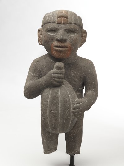 رجل يحمل جراب الكاكاو ، 1440-1521 (حجر بركاني مع آثار صبغة حمراء) بواسطة ازتيك