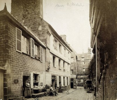 The hotel and the Poulard Inn at the entrance of Mont-Saint-Michel, late 19th century بواسطة مصور فرنسي