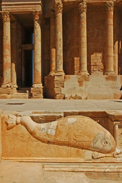 Dolphin carving in front of stage, Sabratha, Libya, c.190 AD بواسطة رواية