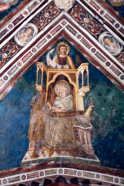 View of the detail of a fresco decorating one of the vaults of the Upper Church representing the four doctors of the Roman Church: St. Ambrose of Milan and the evangelist Saint Mark. made by the school of Siena from the beginning of the 14th century. Monas بواسطة مدرسة Sienese