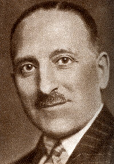 سي إم وولف ، منتج أفلام بريطاني ، 1933 بواسطة غير معروف